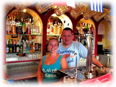 Barry and Peppar behind the bar of the Hole in the wall